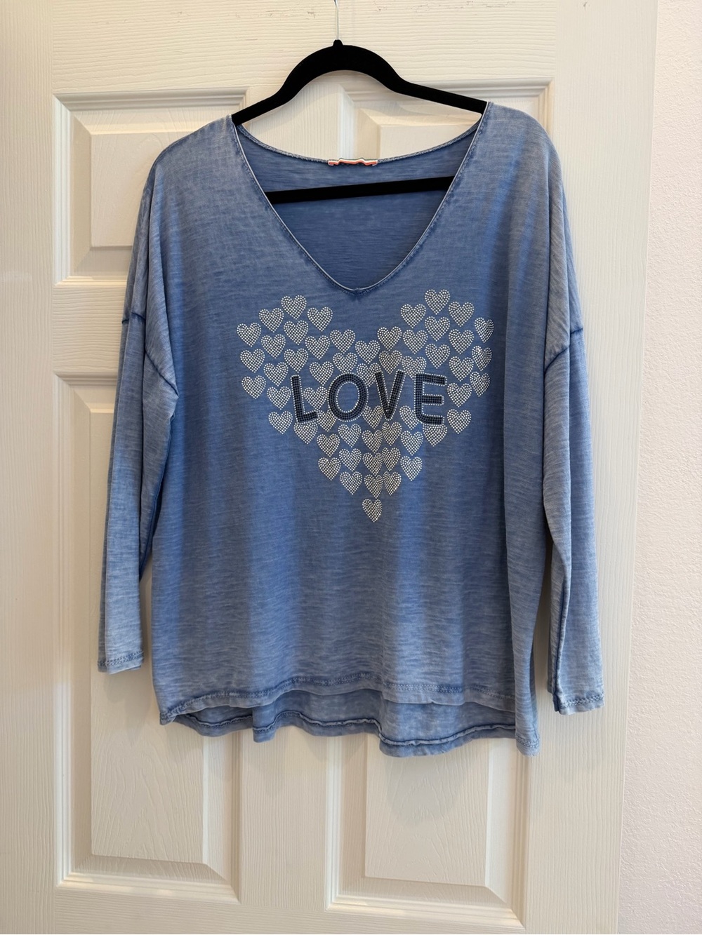 Like new. Tag removed. Women's Light Blue 'LOVE' V-Neck Heart Graphic Top.